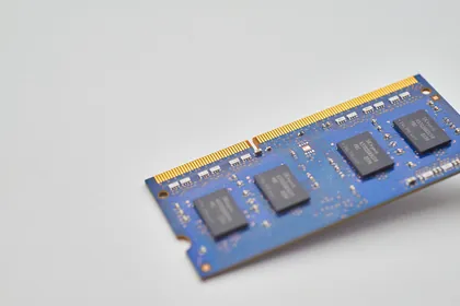 A stick of laptop memory on a light grey background
